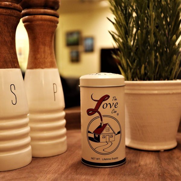 The Love Can next to salt and pepper grinders