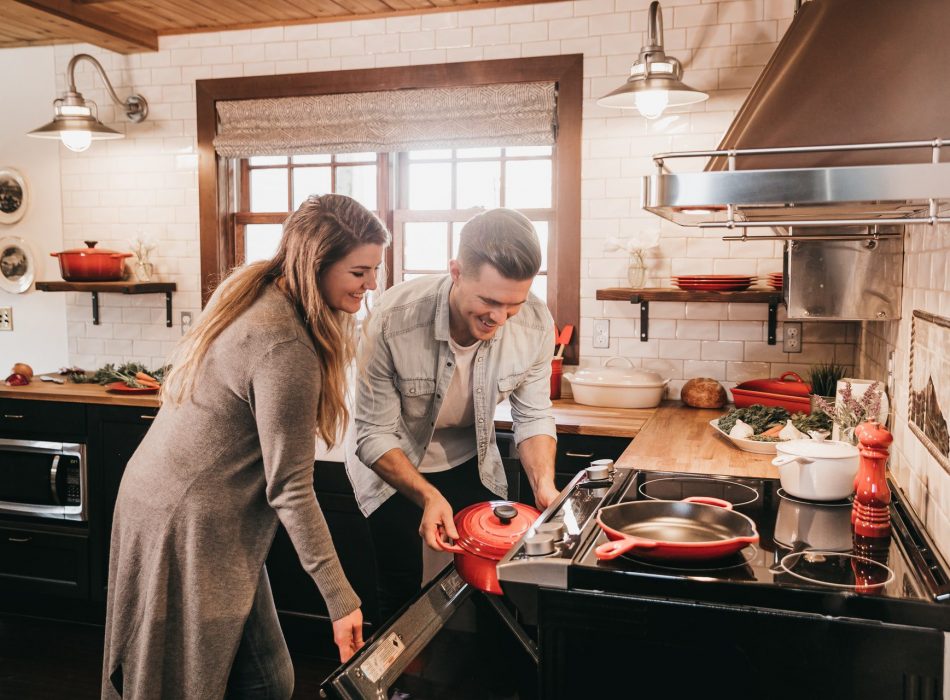 Couple cooking in a rustic modern kitchen